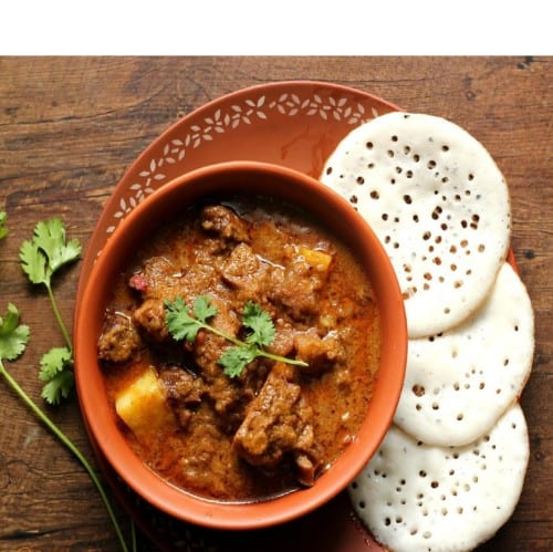 Kal Dosa with Mutton Kulambu.