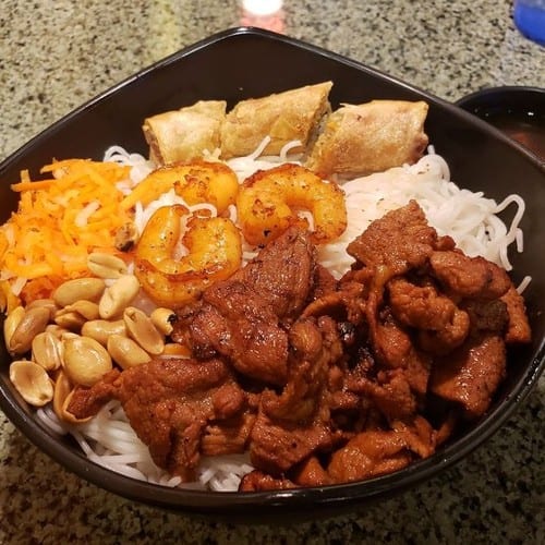 70. Bun Tom Thit Nuong Cha Gio / Grilled Shrimps, Sliced Pork, & Egg Rolls with Rice Vermicelli.