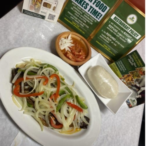 Grilled Tilapia served with banku, kenkey, or plantains and fresh pepper.