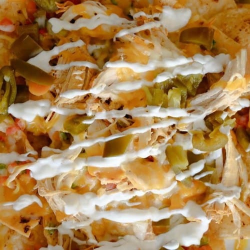 NACHOS WITH PULLED CHICKEN.