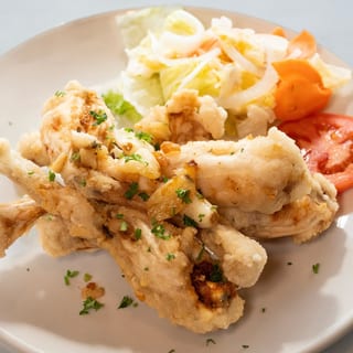 Frog legs sautéed with garlic and butter