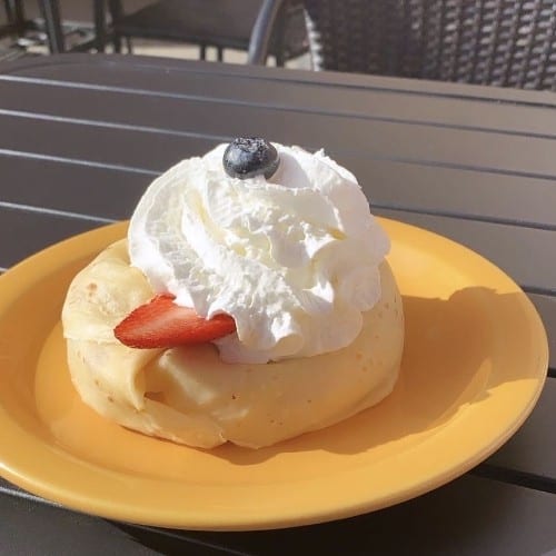 Crème Brulee Crepe with Strawberries and Blueberries.