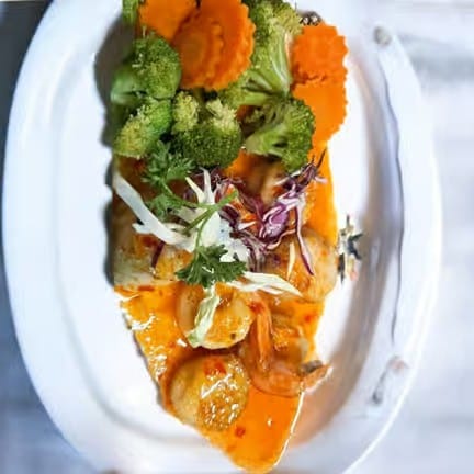 Jumbo Prawn Tempura Glazed with Sweet Chili Reduction Sauce.