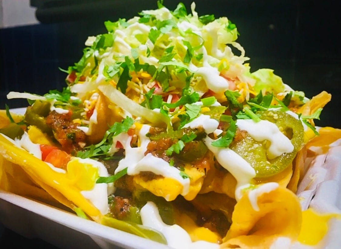 Al Pastor (Marinated Spiced Pork) Nachos Grande.