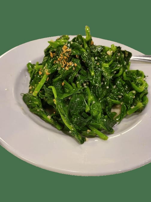 81. Braised Pea Pod Leaves W/egg Yolk / 金銀蛋浸豆苗.