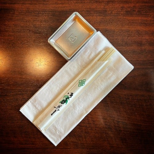 Chopsticks and soy plate per Person.