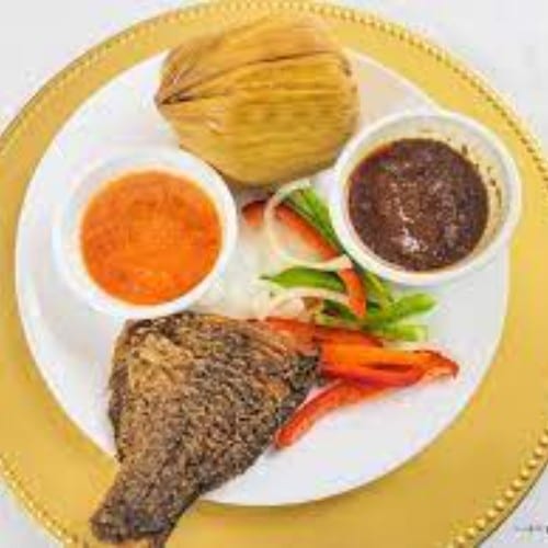 Grilled Tilapia with Kenkey & hot sauce.