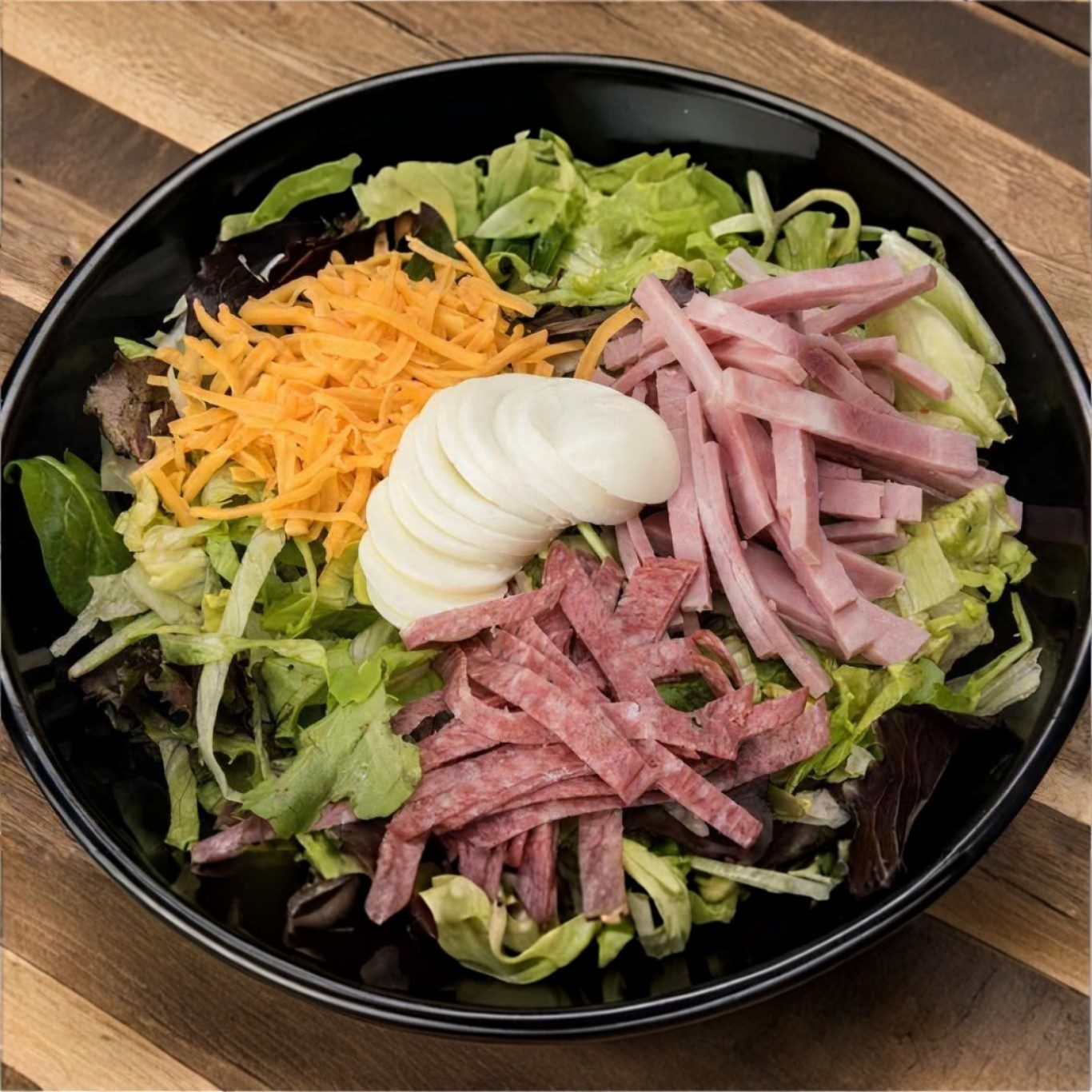 Deli Chef Salad. Made with a mix of iceberg lettuce, cabbage and carrots..