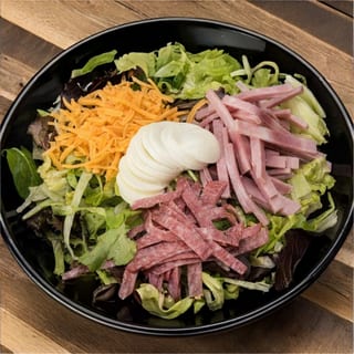 Deli Chef Salad. Made with a mix of iceberg lettuce, cabbage and carrots.