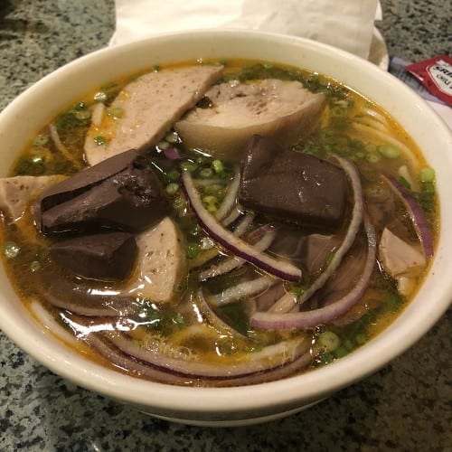 76. Bun Bo Hue / "Hue'' Style Spicy Beef Broth Soup with Thick Rice Vermicelli.