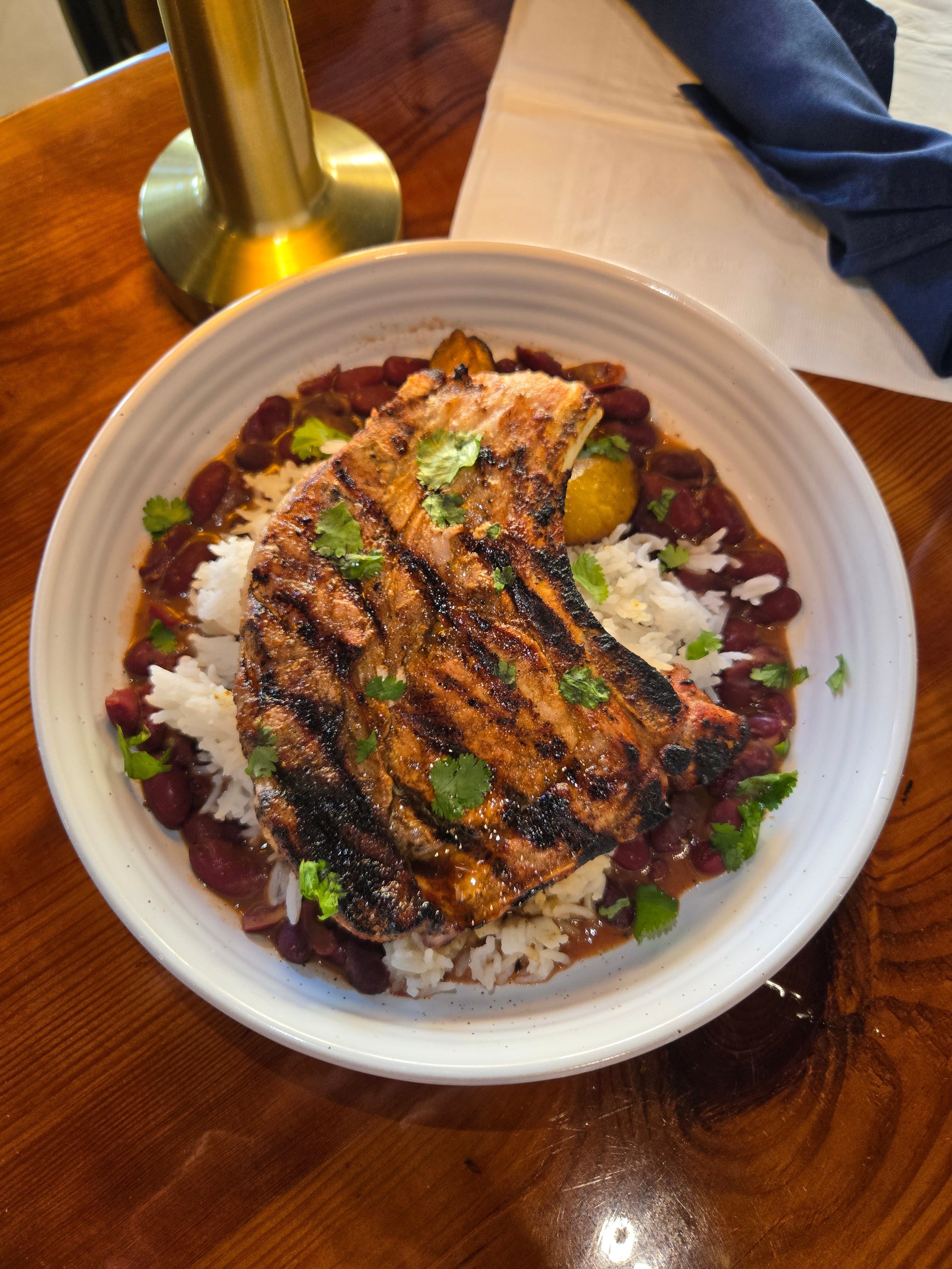 Mojo-Infused Pork Chop W/ Rice & Beans.