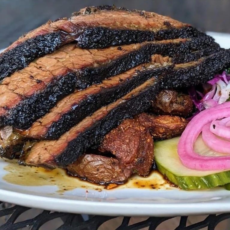 Indulge in Tender, 12-Hour Smoked Brisket!