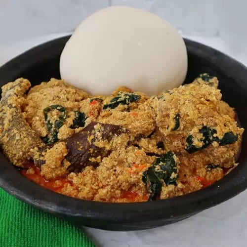 Egusi with fufu serves with fried Fish.