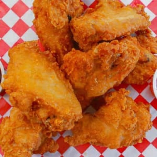 21 Crispy breaded wings, freshly fried and tossed..