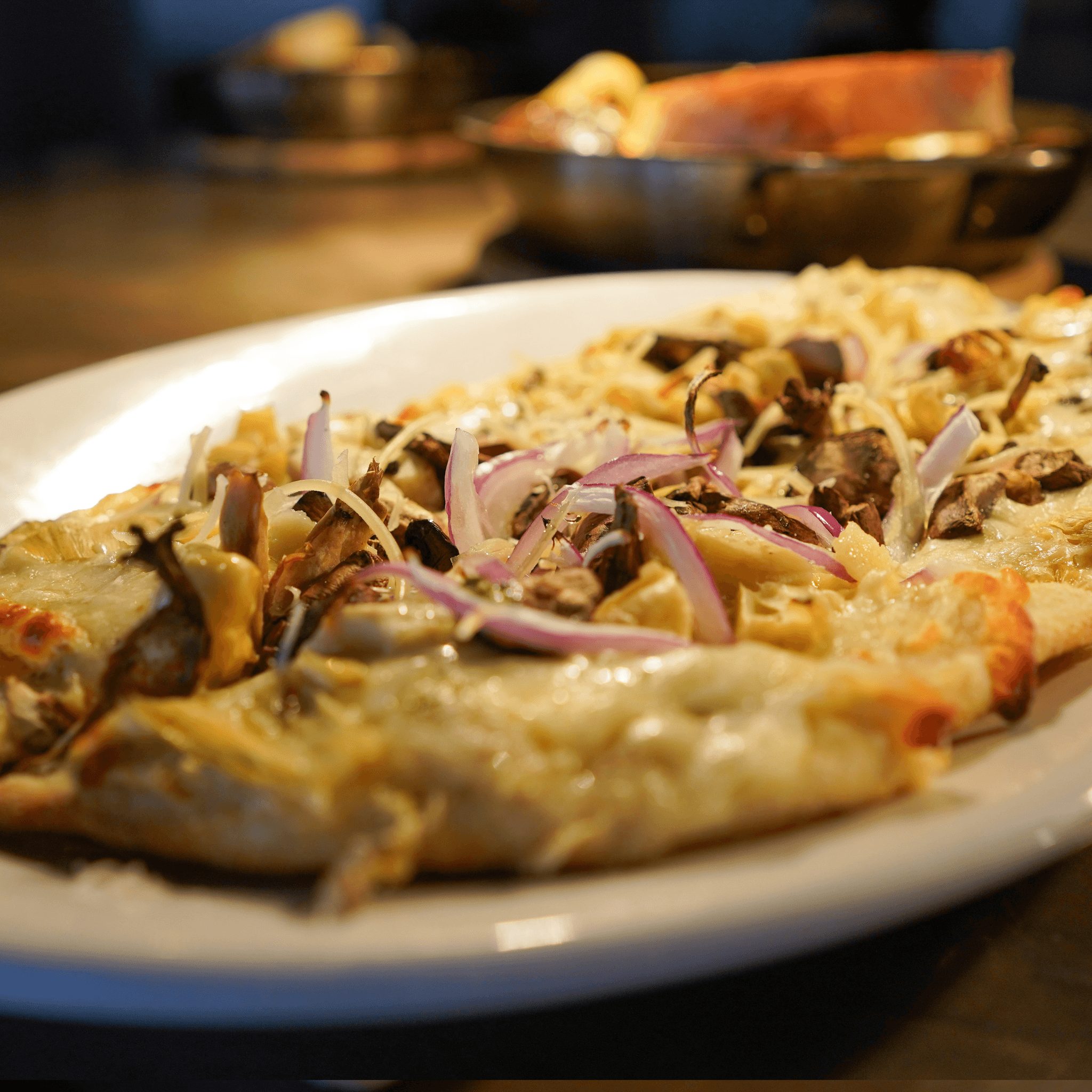 MUSHROOM-ARTICHOKE PIZZA.