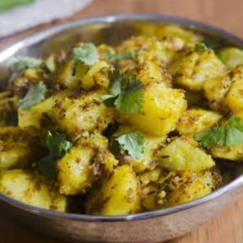 Dry Potatoes with Jeera Jain.