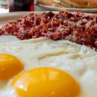 OUR FAMOUS CORNED BEEF HASH WITH TWO EGGS