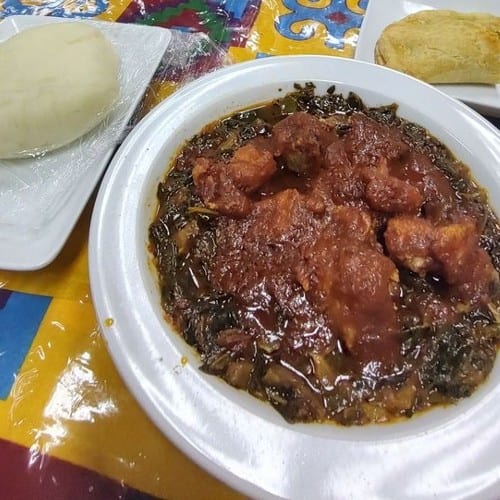 Efo Riro W/ Pounded Yam served w/ chicken or fish..