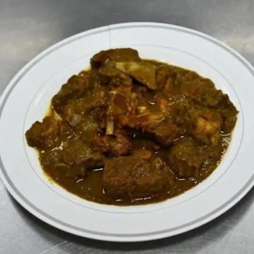 Curry Goat Rasta Paata Cabbage and Plantains.