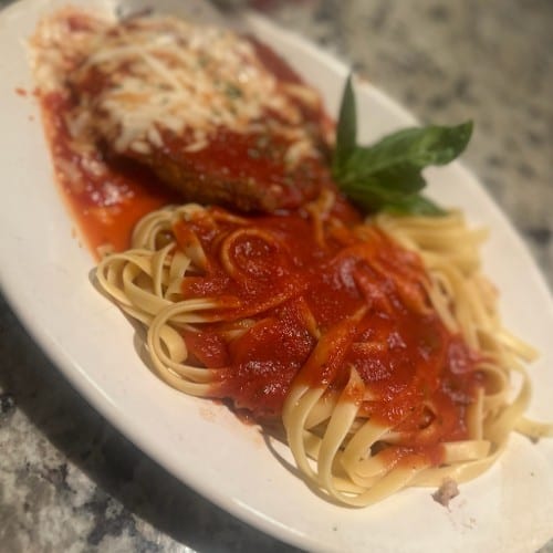Chicken Parmesan Over Fettuccine.