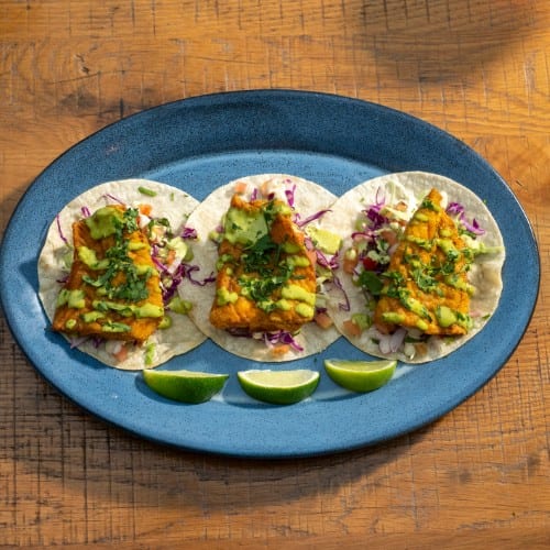 CAVA'S FISH TACOS.