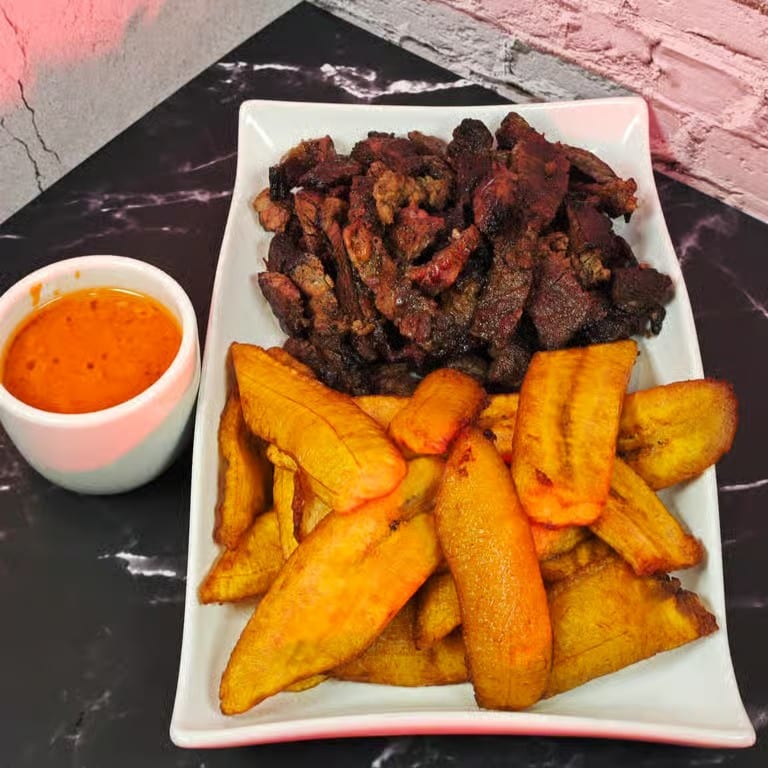 Suya with Fried Plantains or Jollof Rice.