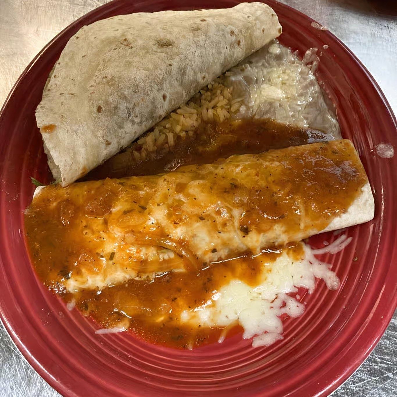 22. One Beef Burrito, One Beef Taco, Rice & Beans.