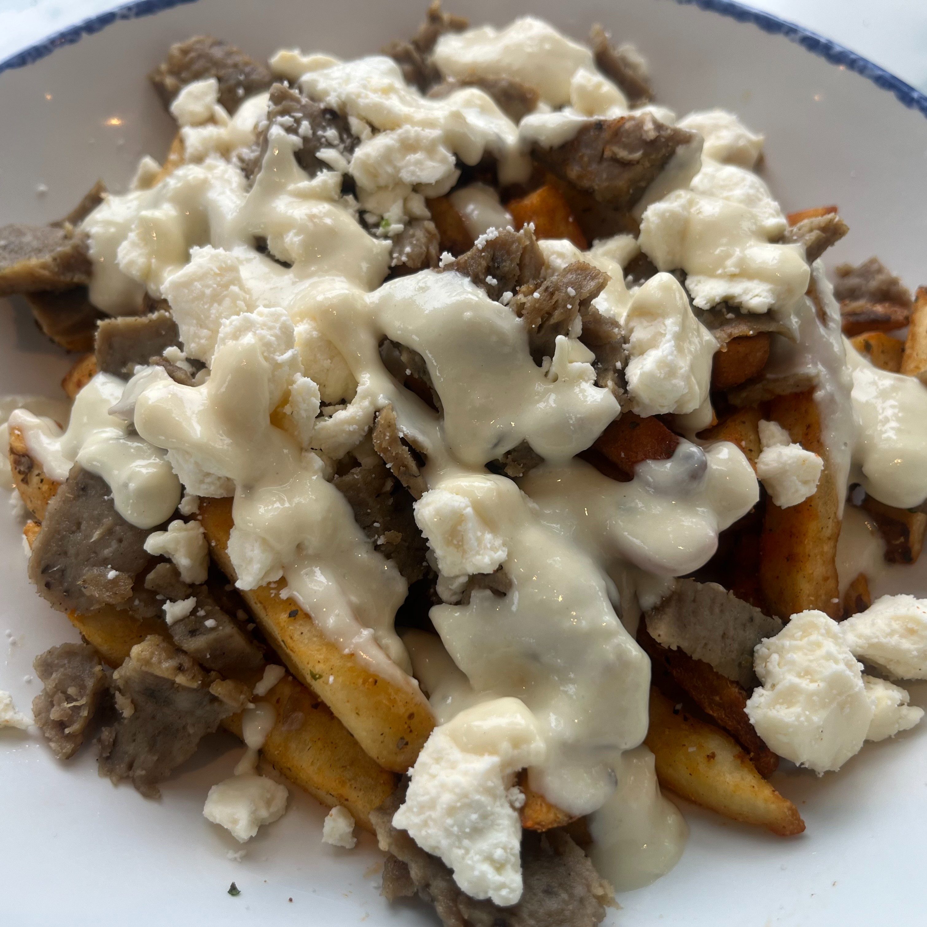 Taza Greek Style Poutine.