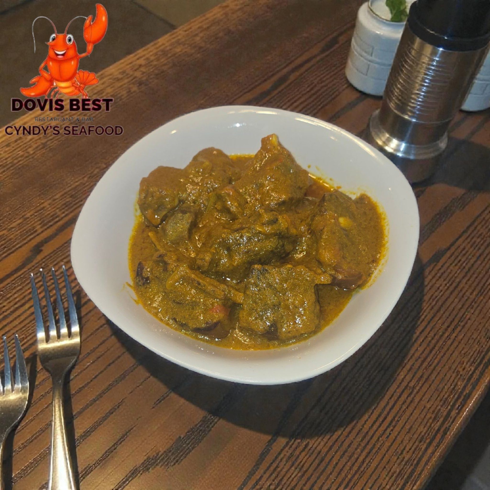 Curry Goat, White Rice or  Plantain.