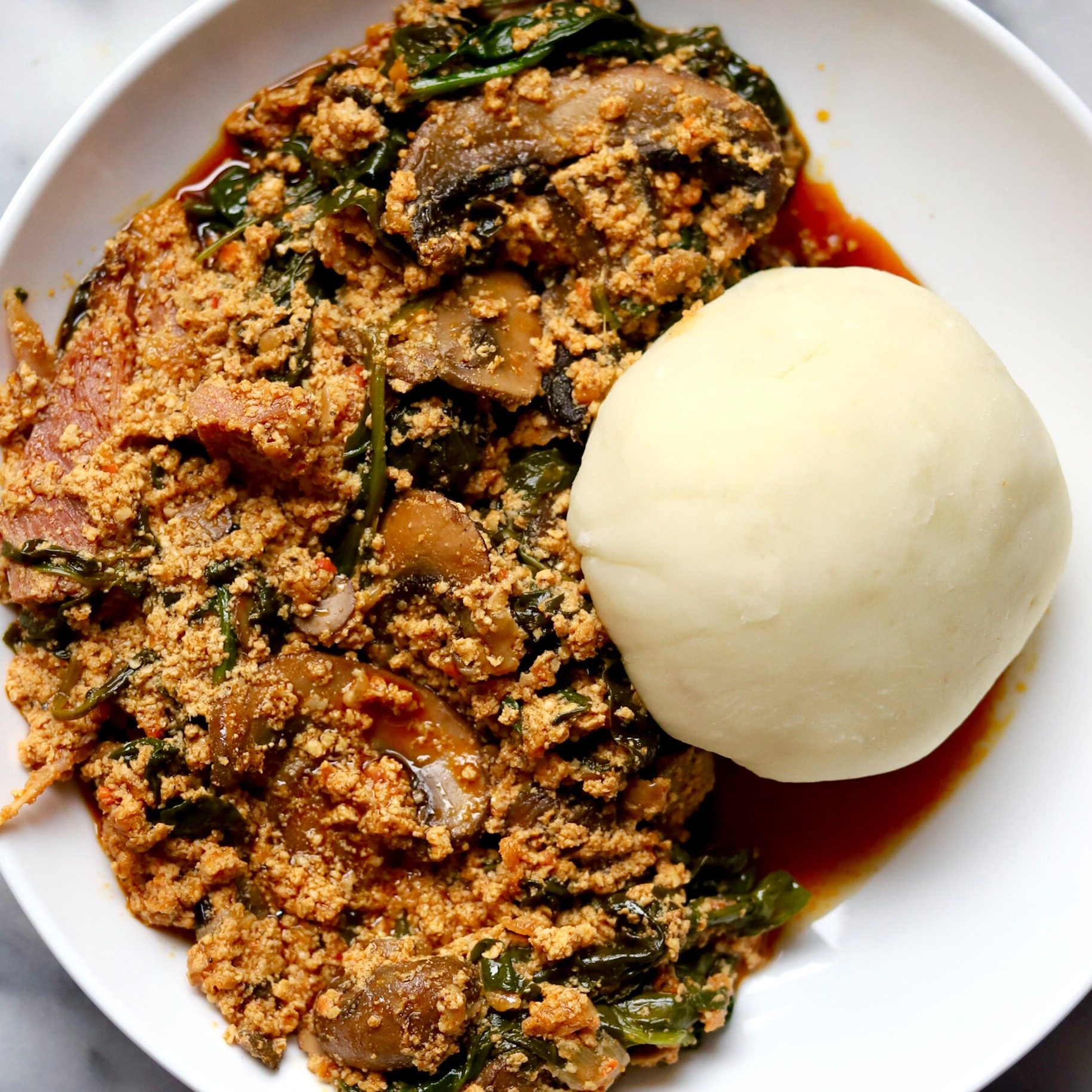 EGUSI W/ FUFU & BEEF MEATS.