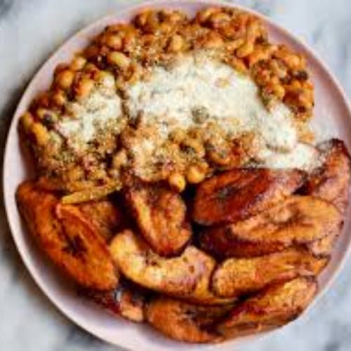 Beans Stew and Fried Plantain serves with meat, fish & egg.