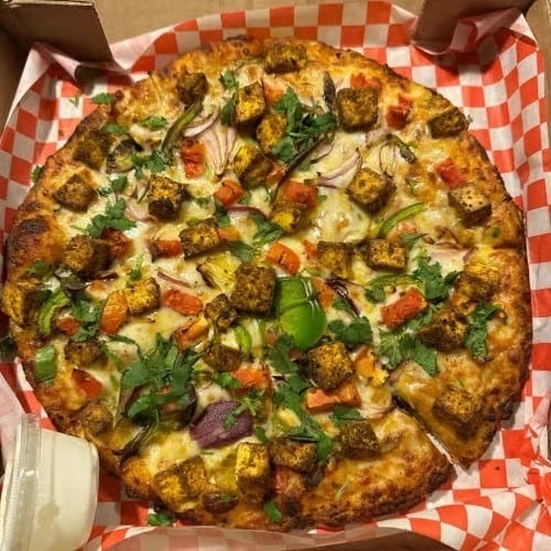 Vegetarian Mighty Munch Curry Paneer Pizza.