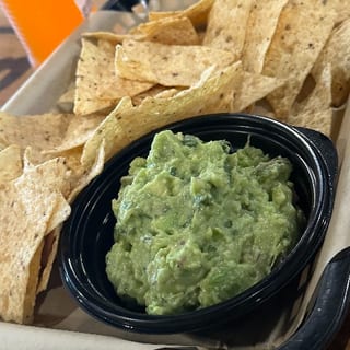 Fresh guacamole with corn tortilla chips