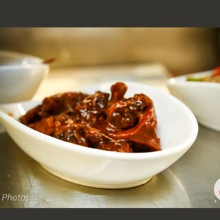Oxtails Served with Rice & Peas Cabbage and Plantain