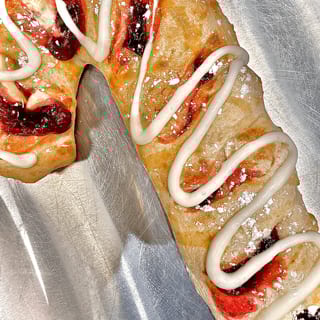Raspberry Stuffed Cane with Frosting Drizzle