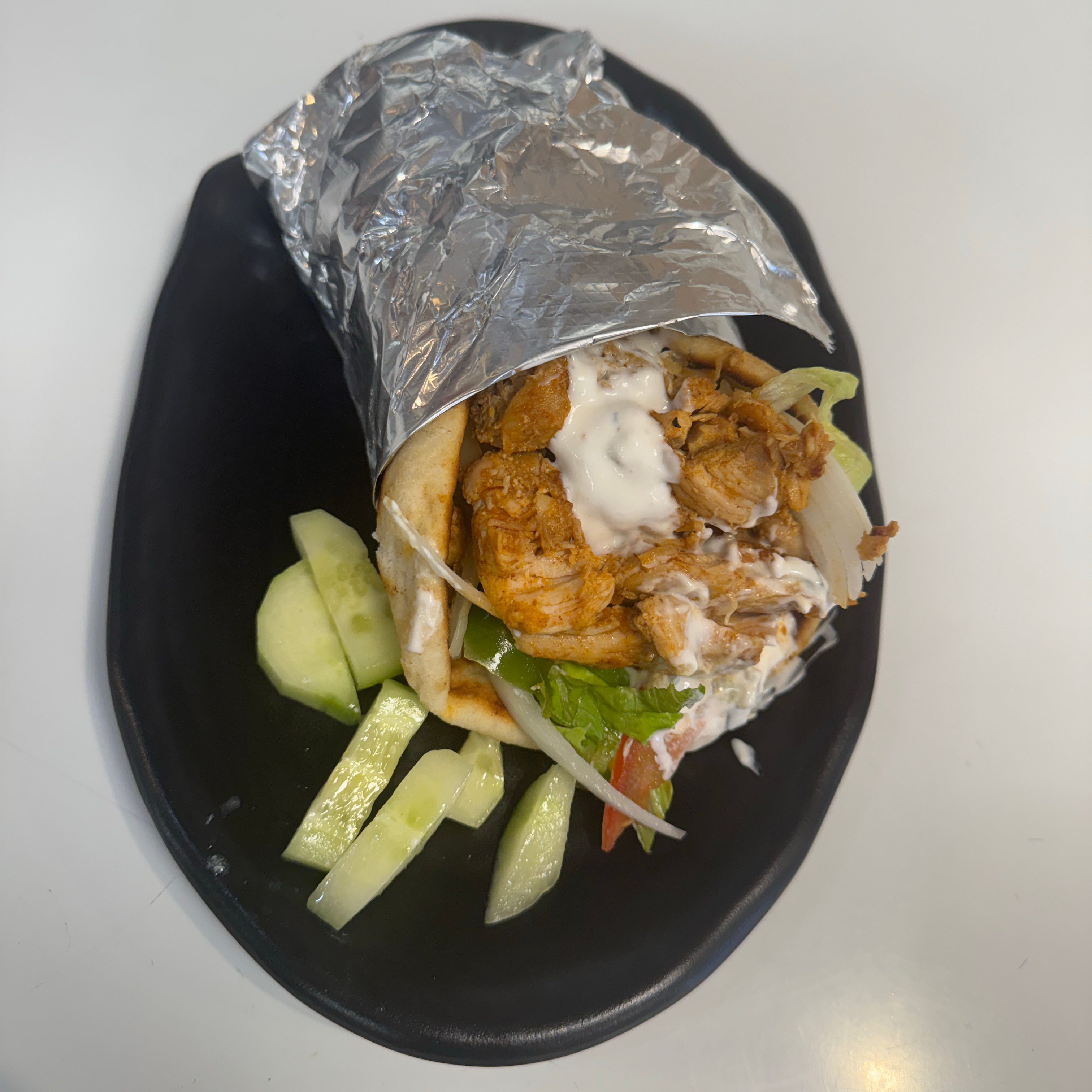 Chicken Gyro Wrap ( Chicken,bread,Lettuce,tomato,onion,pepper,sharjah Sauce).