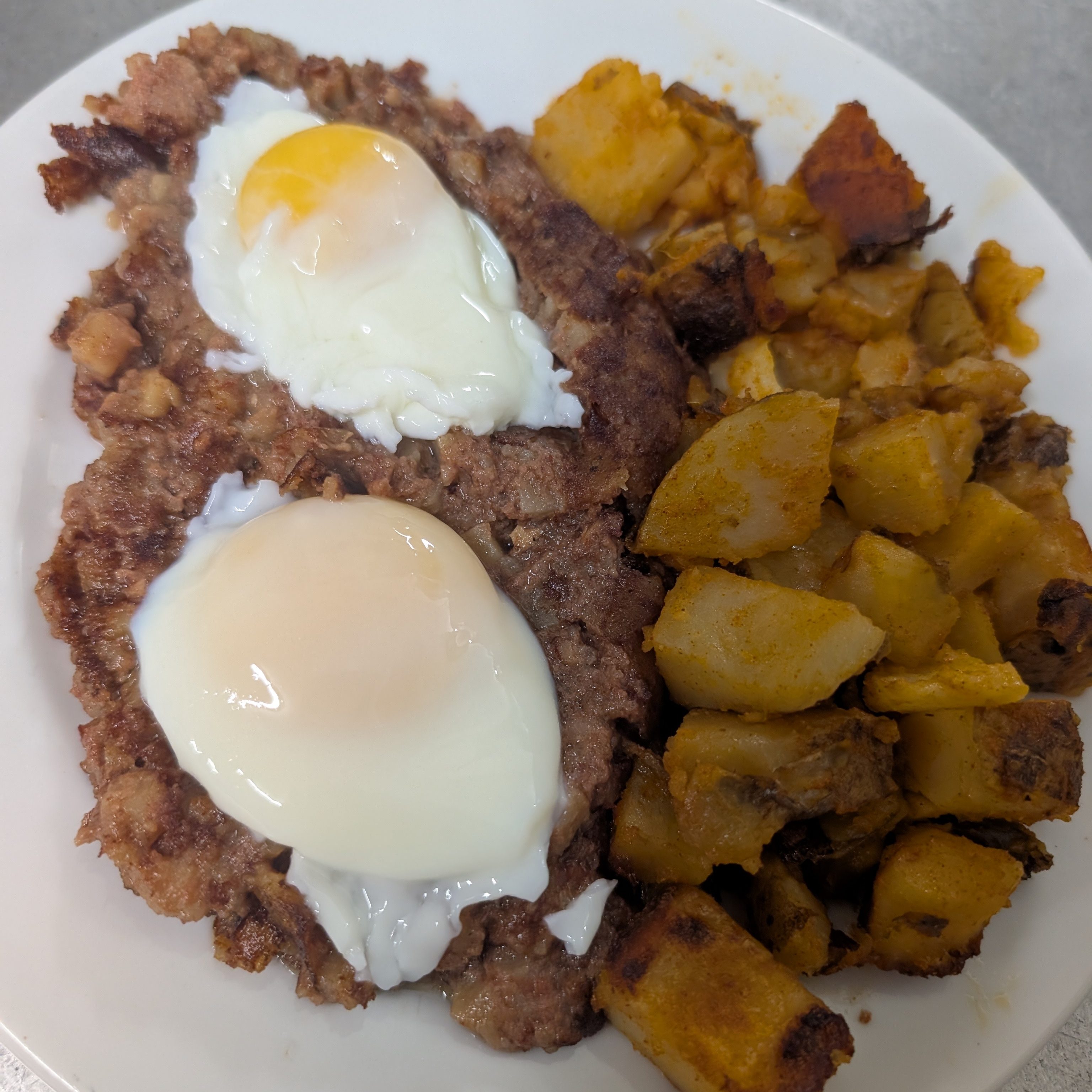 Homemade Hash with 2 Poached Eggs.