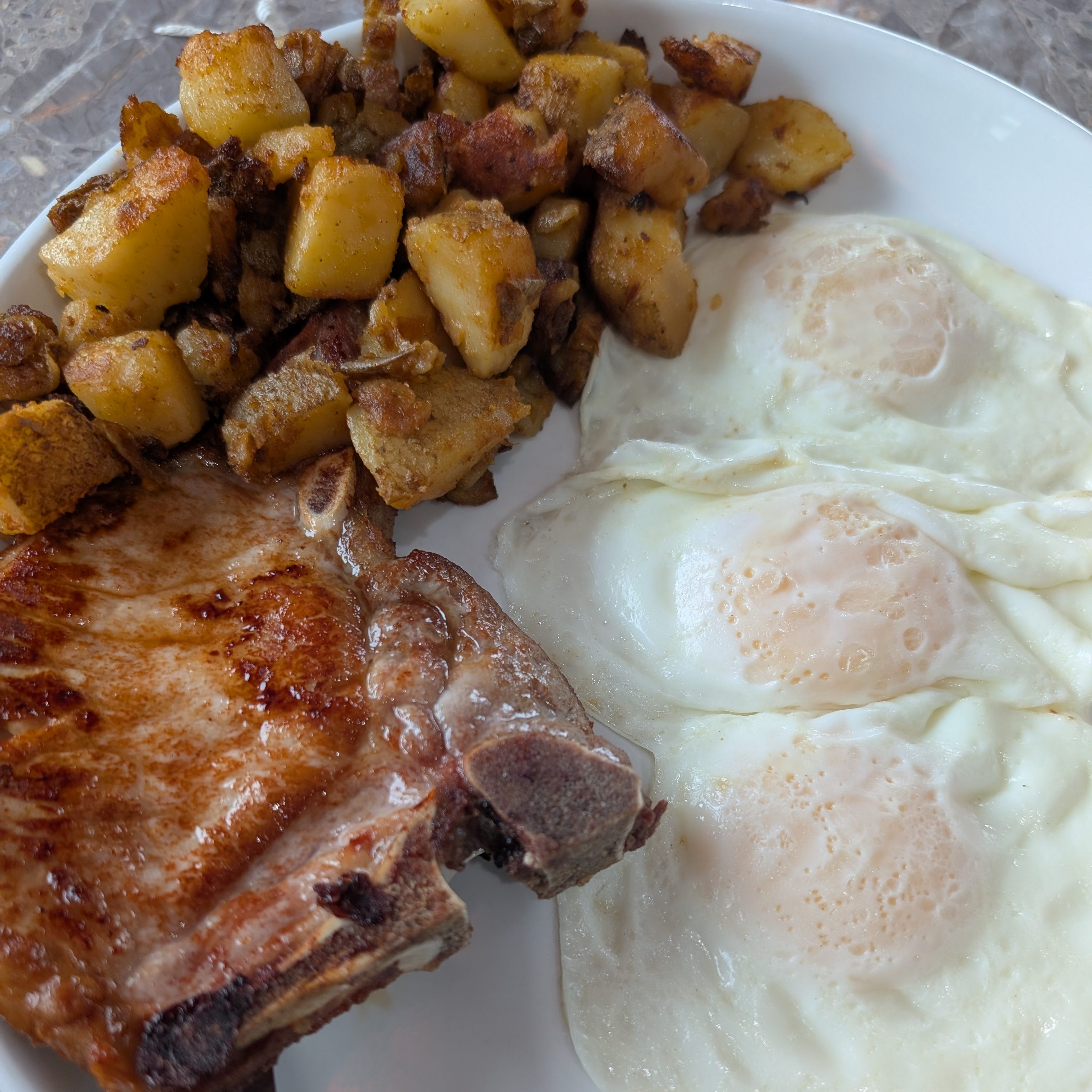 Pork Chop and Two Eggs.
