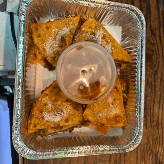 Pizza birria with consomé