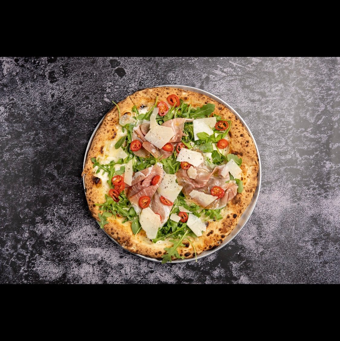 Prosciutto Arugula Pizza.