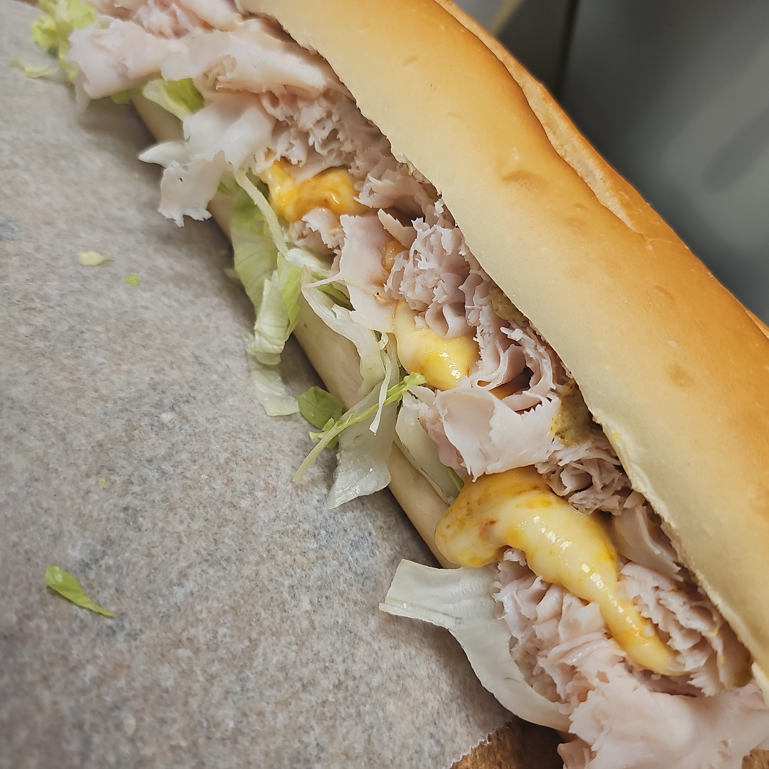 #3 Sliced Turkey Breast, Melted Muenster Cheese  Sandwich.