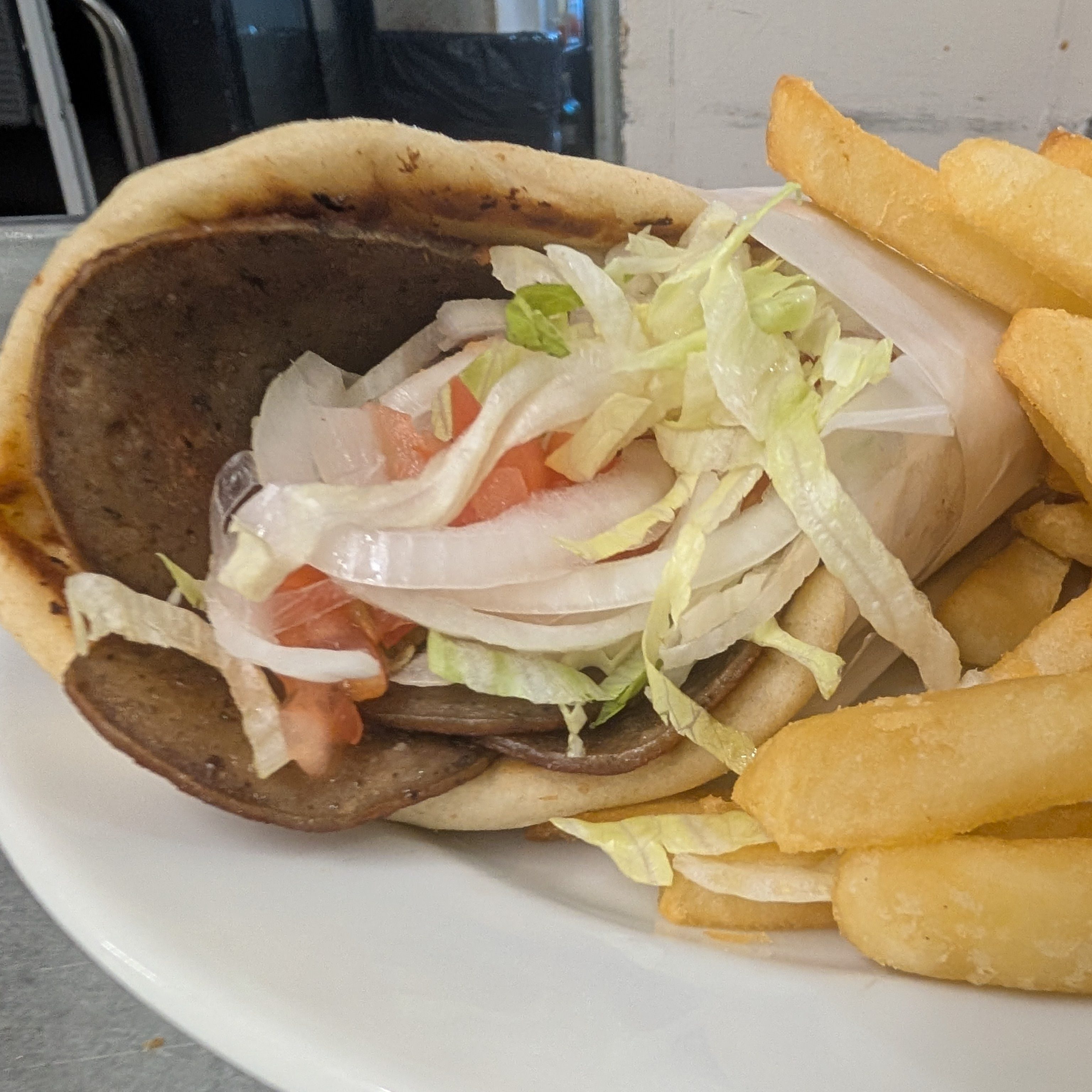 Gyro (Lamb & Beef) on Pita Bread.