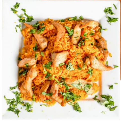 Arroz Con Pollo (Rice with Chicken).