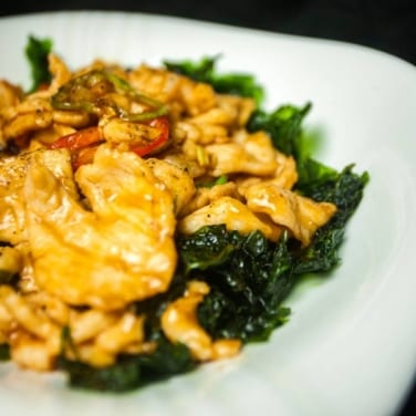 F12. Sautéed Sliced Chicken with Hot Pepper and Crispy Spinach.