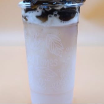 I12. Iced Milk Drink W/ Caramel, Grass Jelly, & Honey Boba.