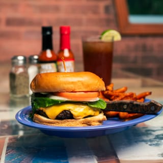 Deluxe Handmade Cheeseburger served with Homey Fries